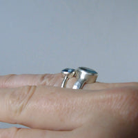 silver ring with oval salt and pepper aquamarine
