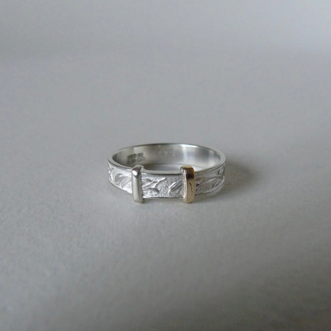 silver 'christening bangle' ring with gold detail