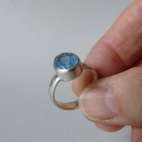 silver ring with oval salt and pepper aquamarine