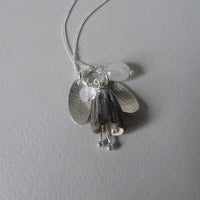 silver leaf and porcelain pod necklace