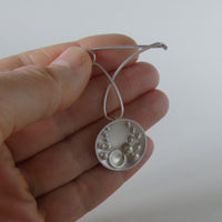 silver Selene medal brooch