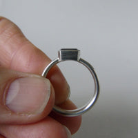 silver ring with octagonal salt and pepper aquamarine