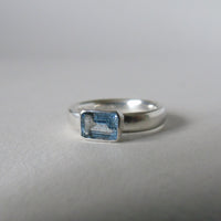 silver ring with octagonal salt and pepper aquamarine