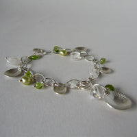 silver leaf and peridot charm bracelet
