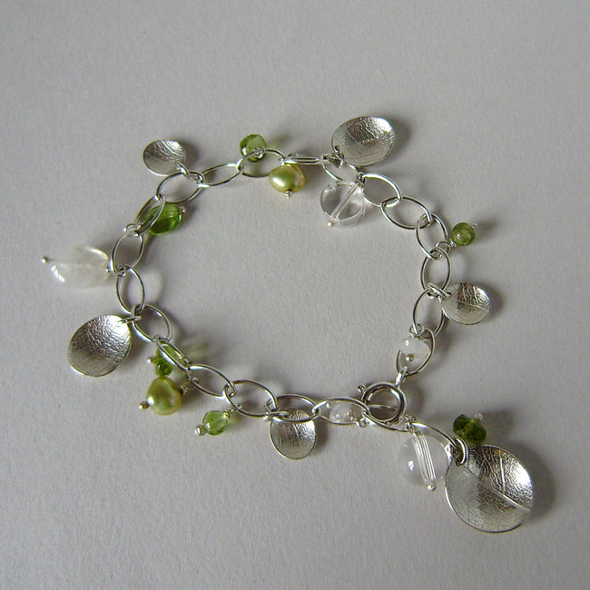 silver leaf and peridot charm bracelet