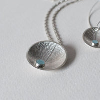 silver domed leaf necklace with dewdrop